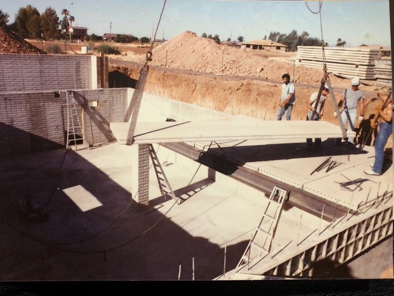 A concrete crew setting panels on a residential job site in Arizona