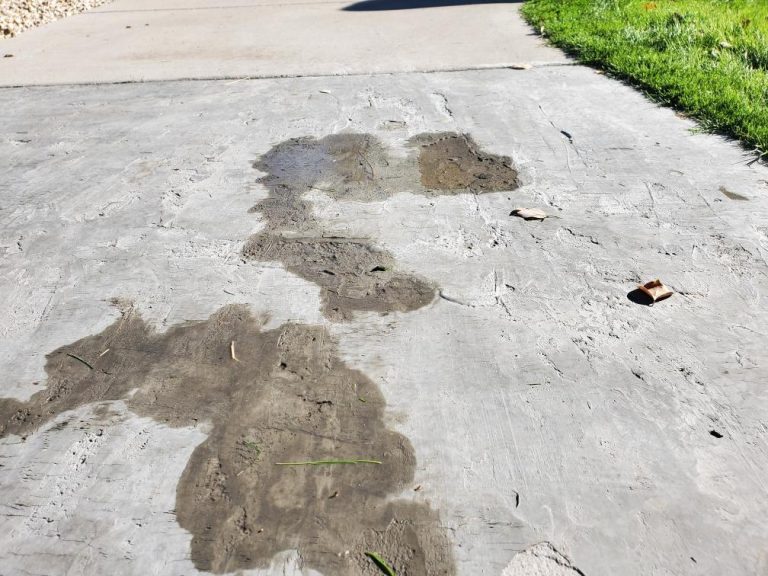A concrete sidewalk that is chipped and damaged from the Phoenix heat.