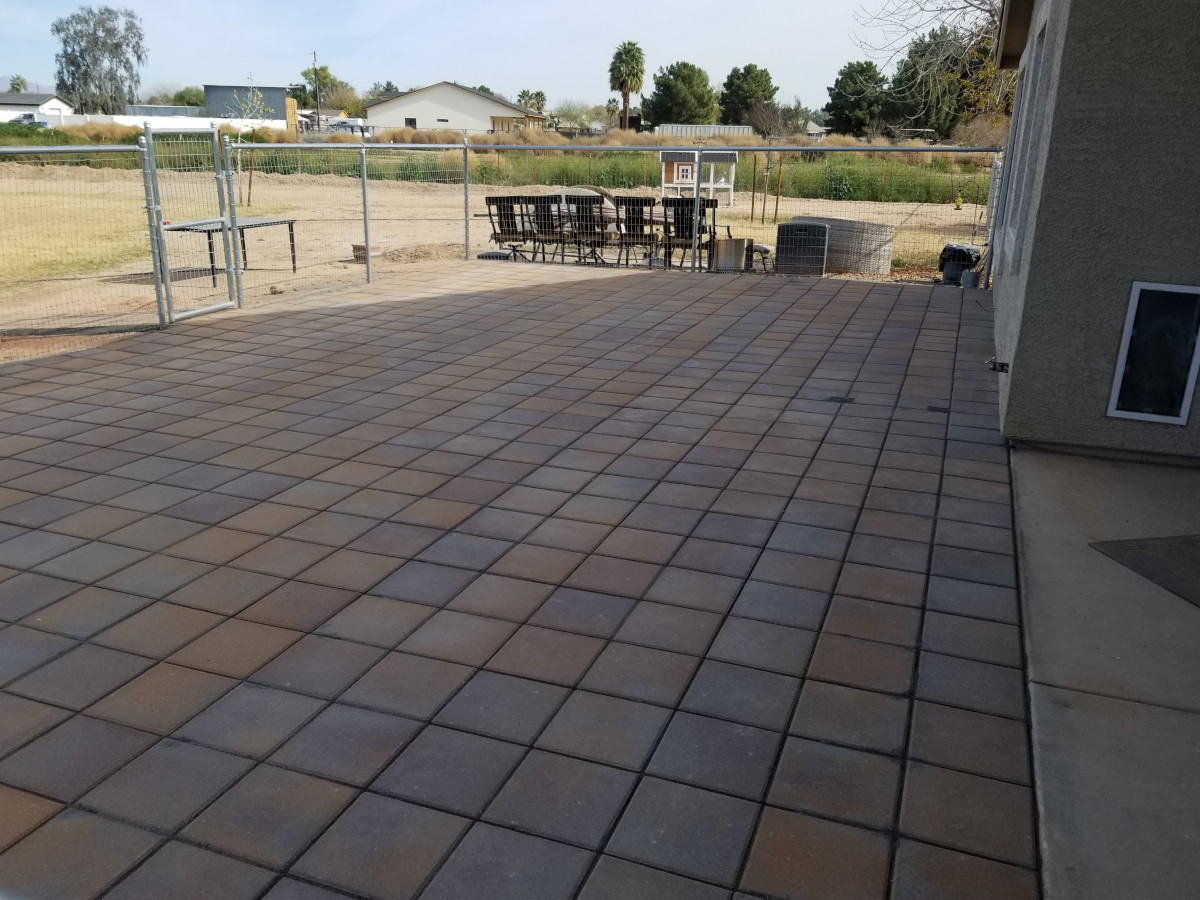 Completed paver patio installation in a Gilbert, Arizona backyard.