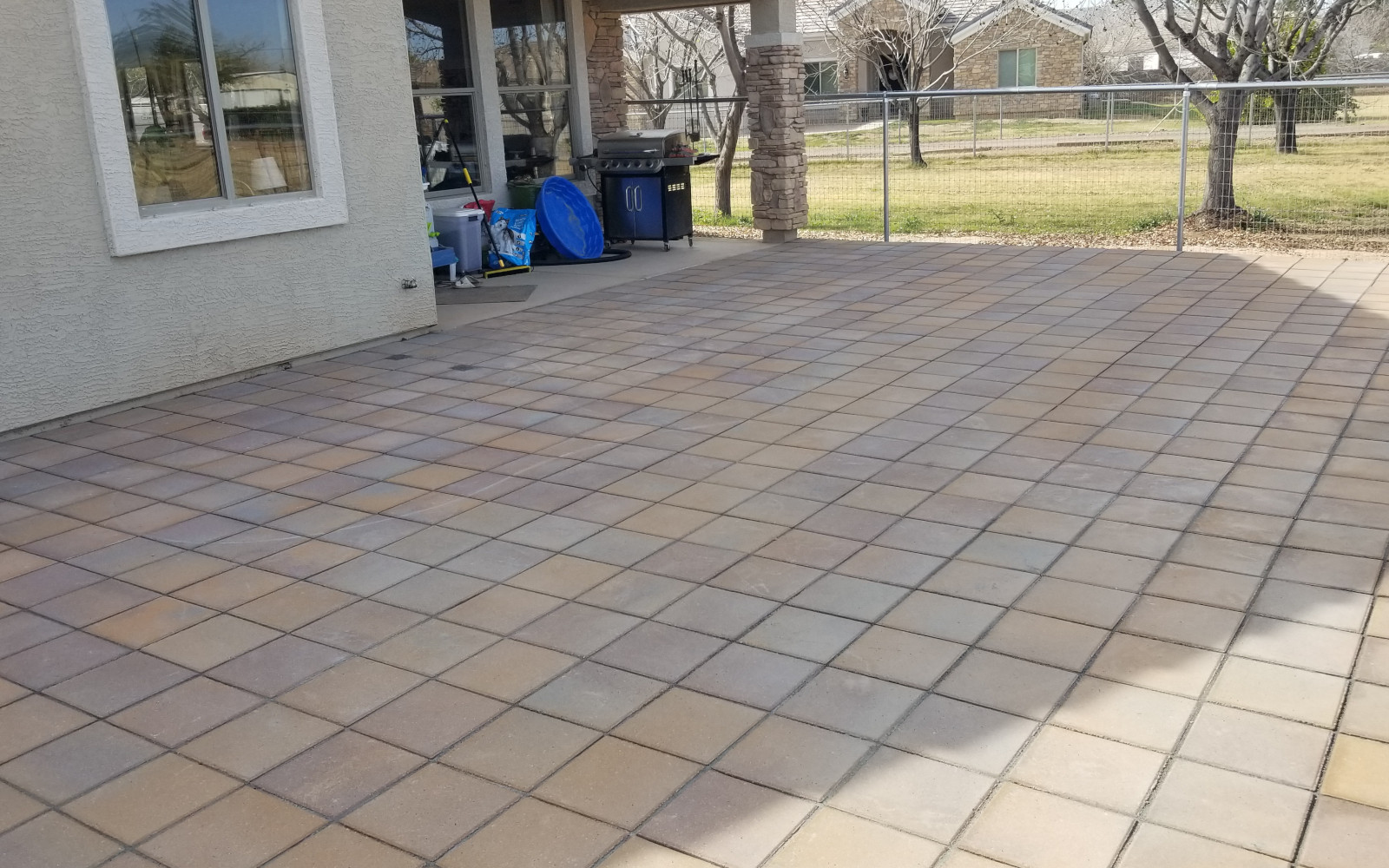 Finished backyard paver patio installation in Gilbert, Arizona.