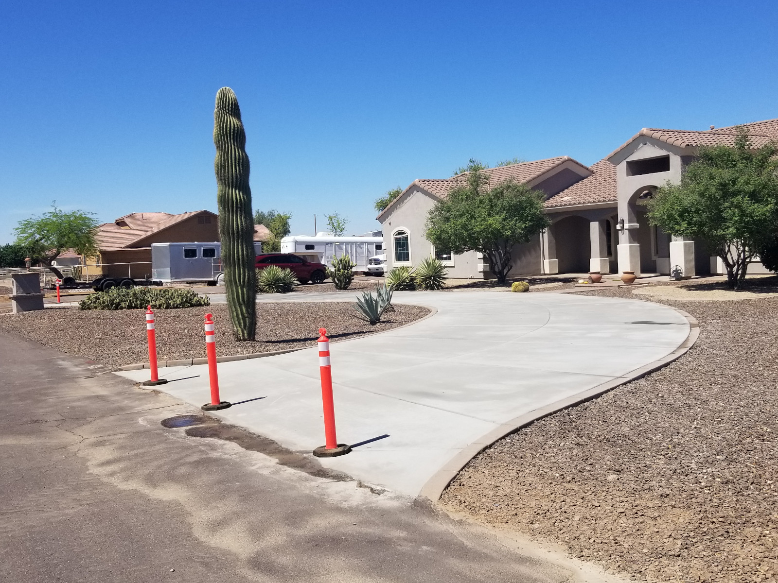 Finished residential driveway concrete work in Arizona with clean lines and strong curb appeal.