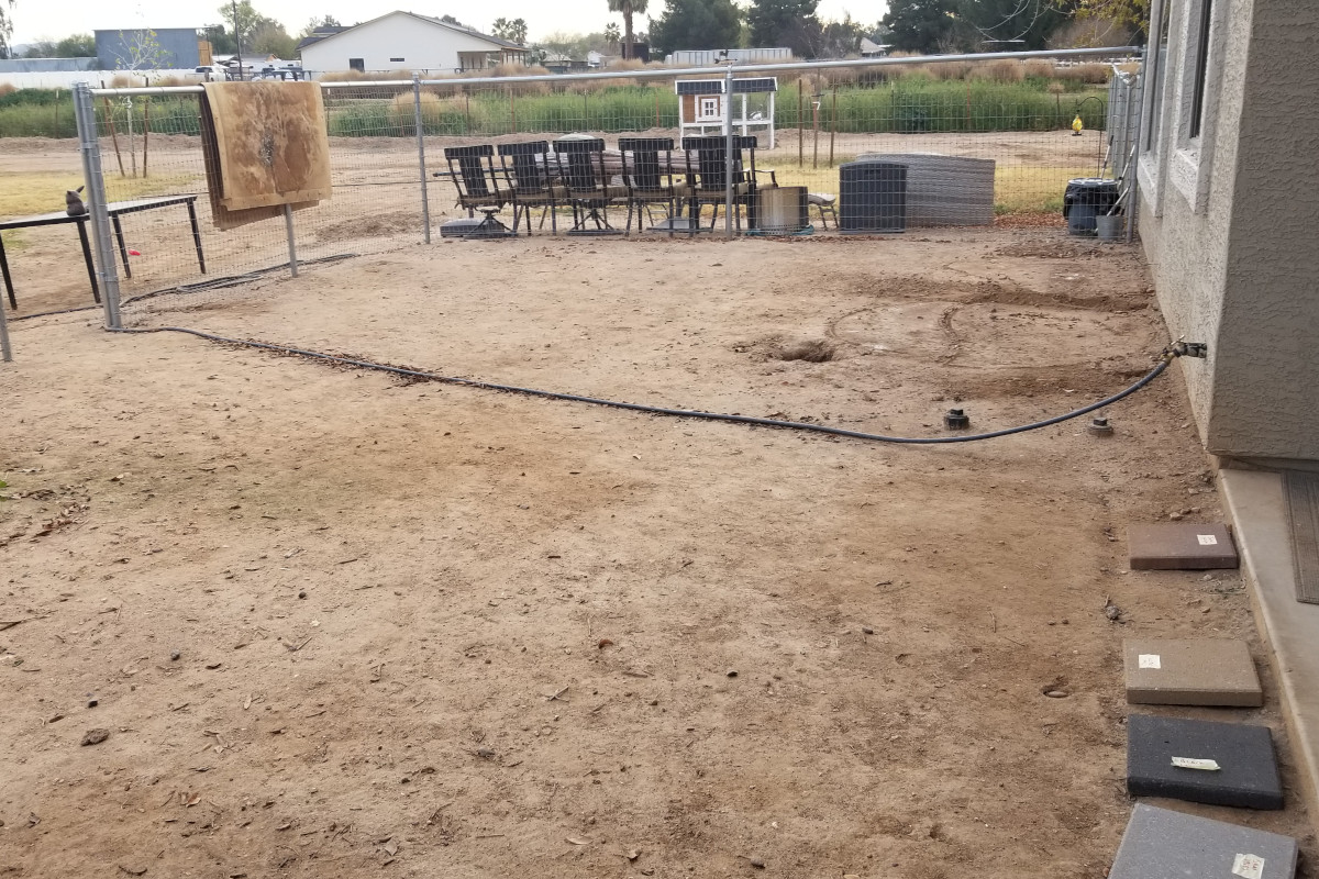 Before picture of the backyard, dirt ground