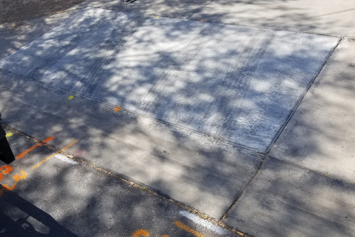 A sun damaged, poorly finished, section of sidewalk