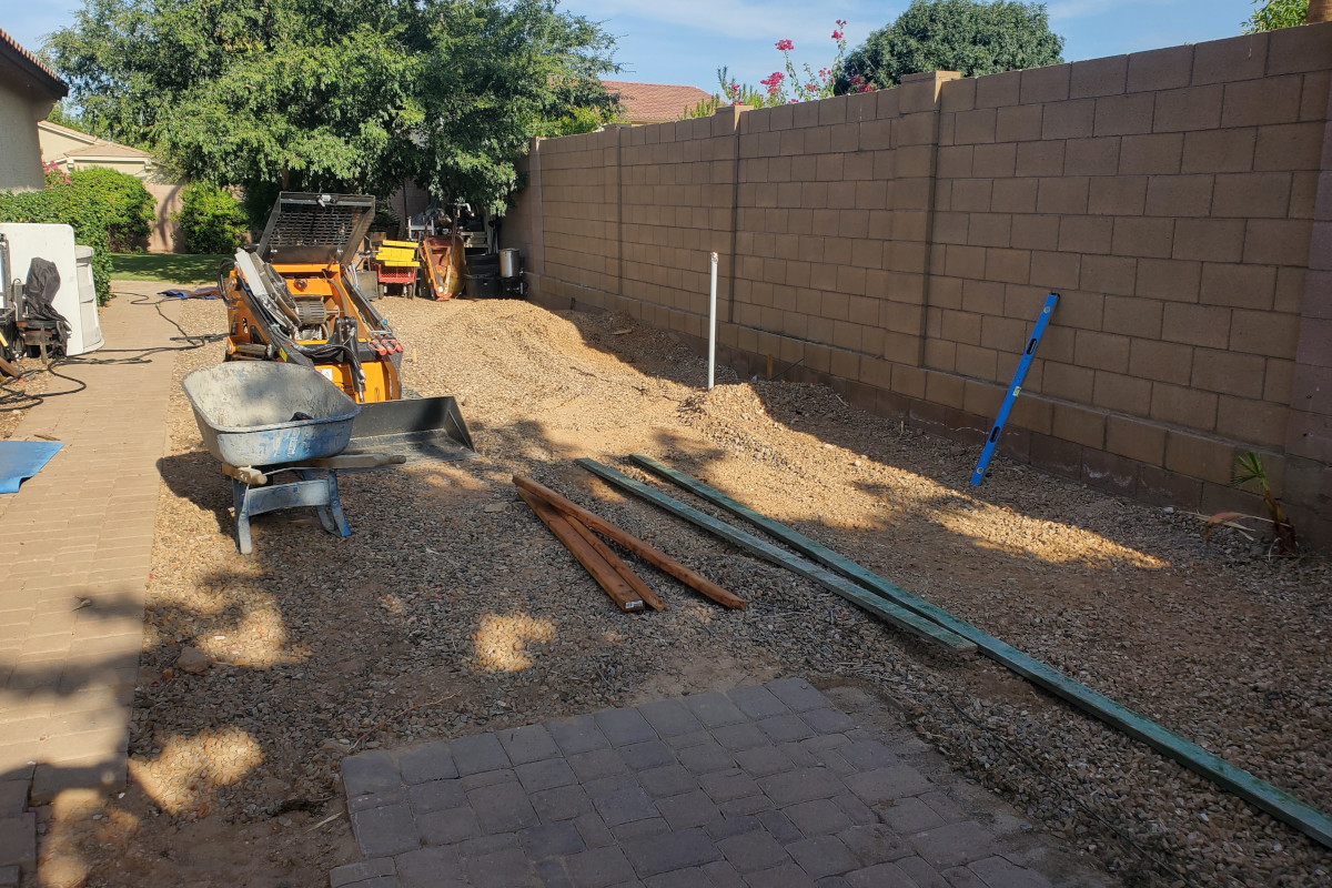 Side-yard gravel area in Chandler before the shed pad and patio concrete work began.