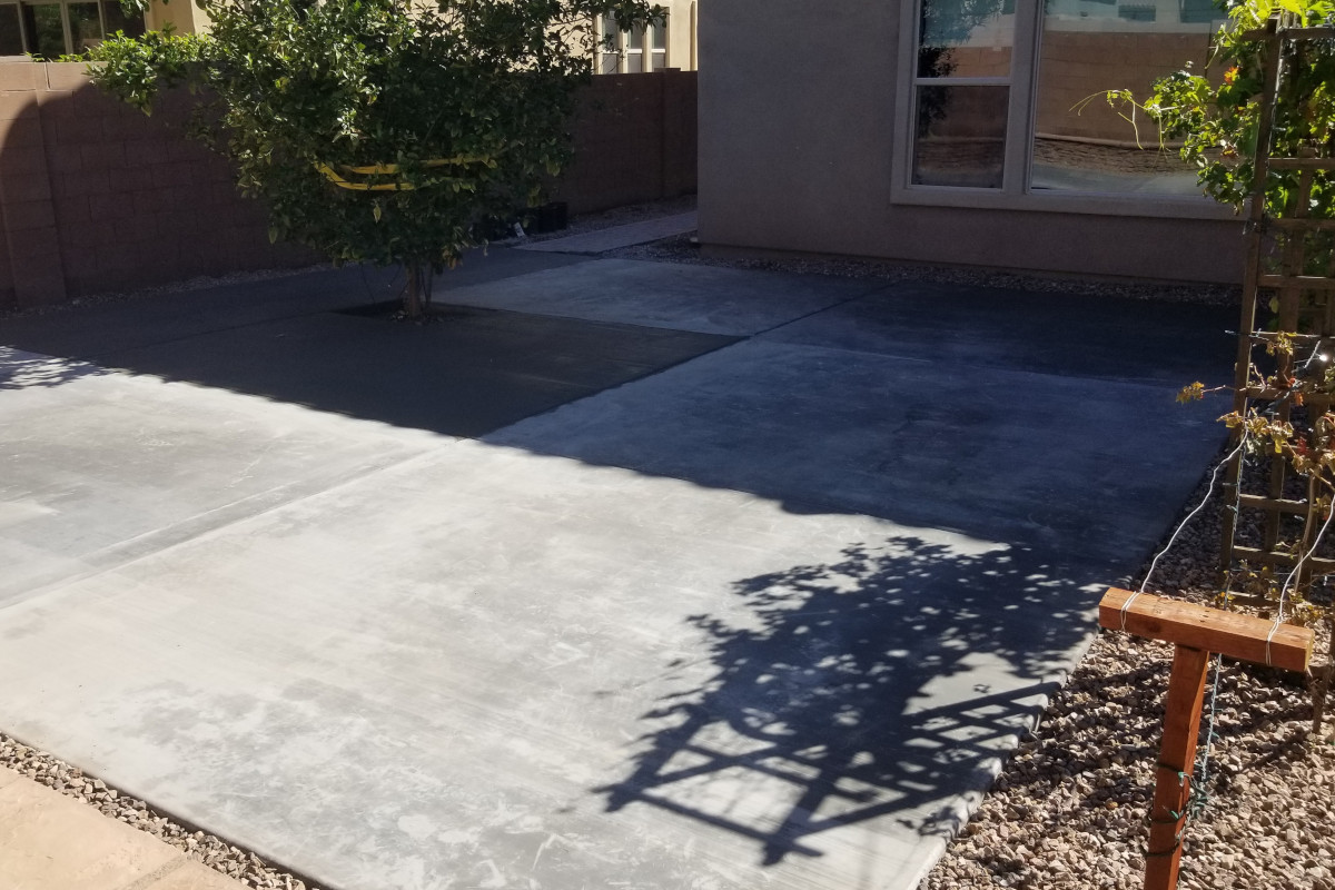 Finished backyard concrete patio during the curing stage.