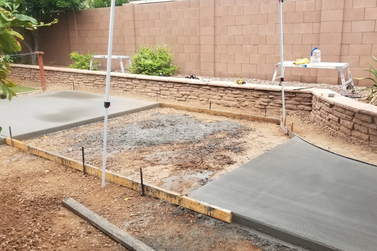 Second pour setup tying new patio sections together around the yard.