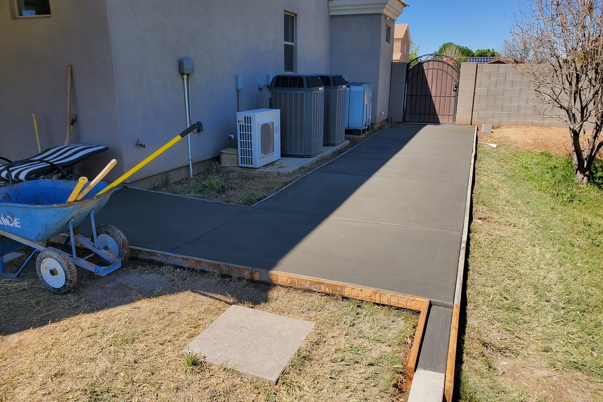 Newly finished side-yard concrete sidewalk addition in Gilbert, Arizona.