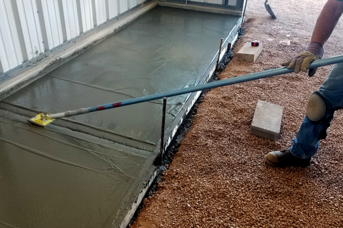 Control joints being added to the fresh concrete tool-storage slab in Chandler.