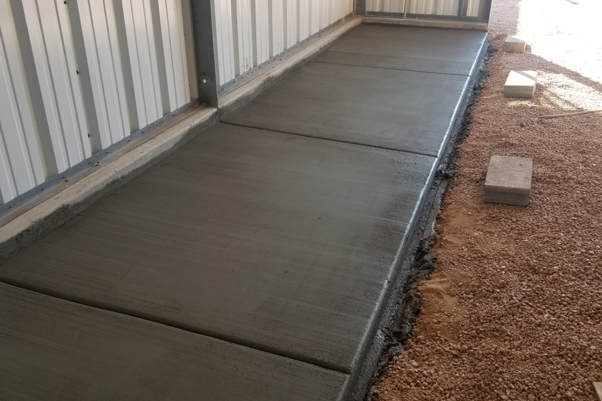 Finished reinforced concrete tool-storage slab inside a Chandler shop building.