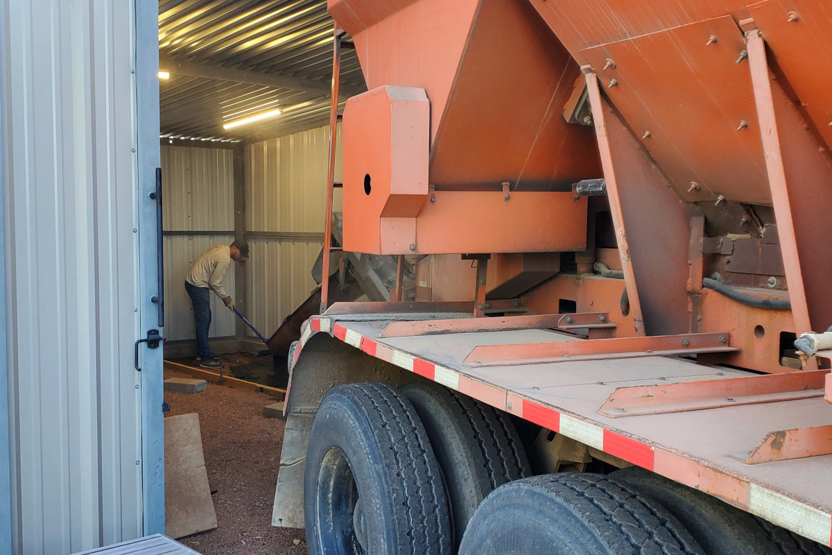 Concrete being placed for an interior reinforced tool-storage slab in Chandler, Arizona.