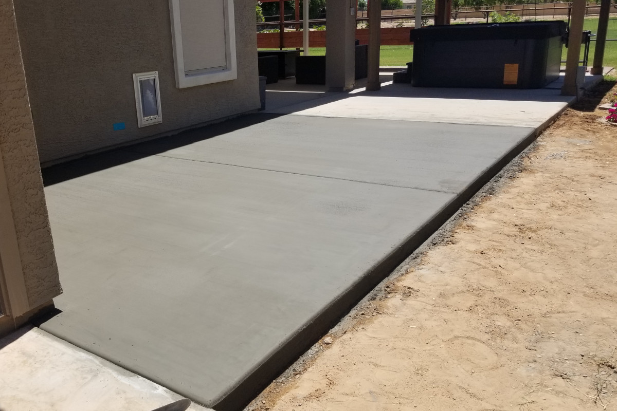 Finished concrete patio extension and dog pad in Gilbert, Arizona.