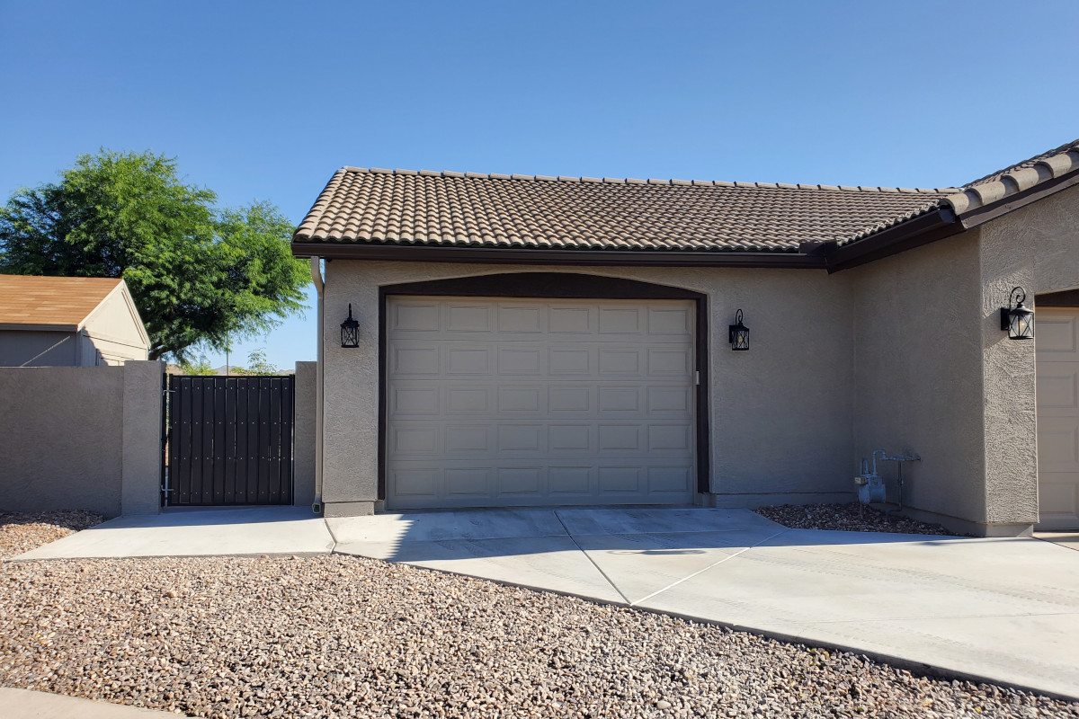 Finished garage home addition with new driveway tie-in in Gilbert, Arizona.