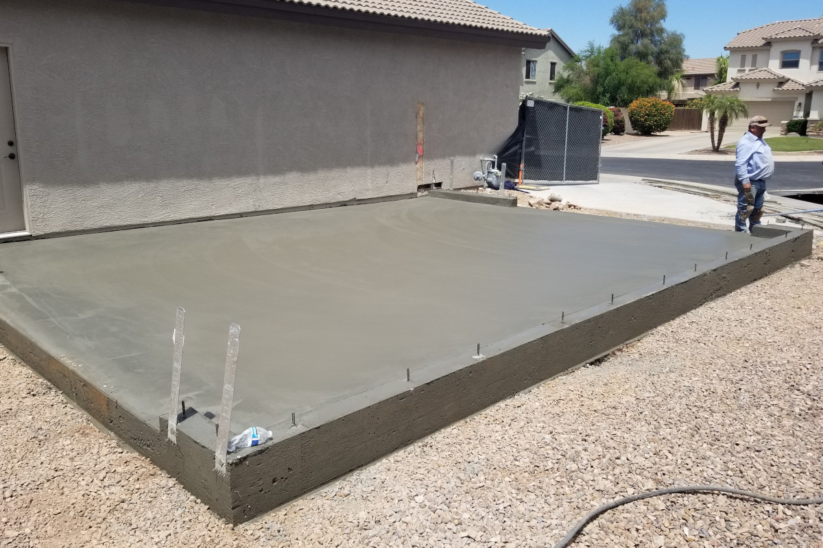 Finished garage addition slab after placement and finish work in Gilbert.