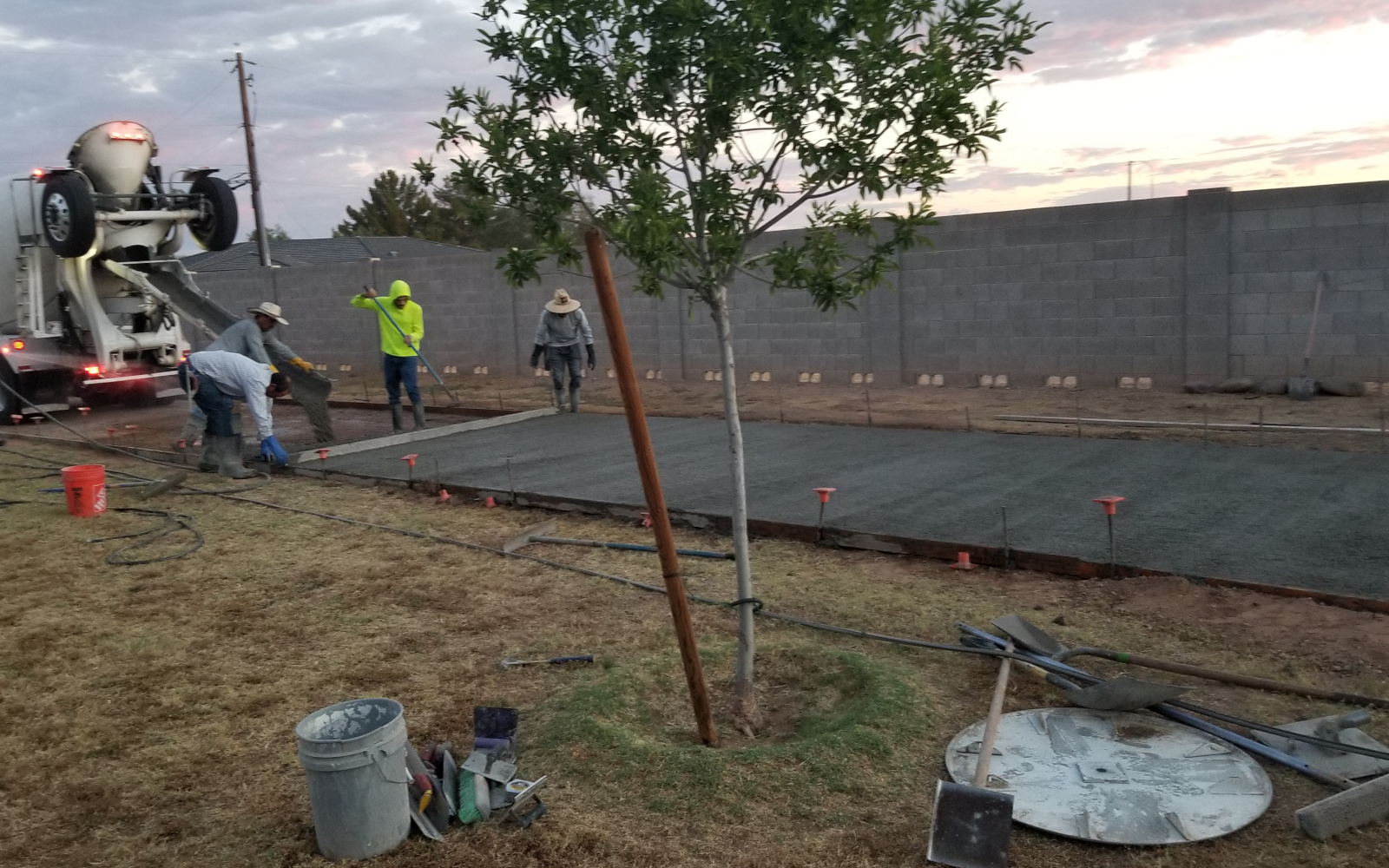 Concrete crew beginning an early-morning driveway pour in Gilbert