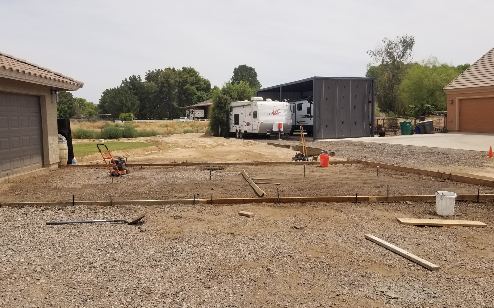 Forms and visible reinforcement at a Gilbert driveway and basketball hoop project