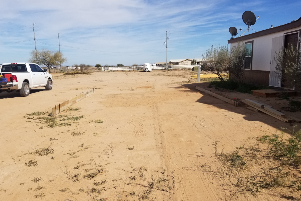 Open area beside a Maricopa home before construction of a concrete pad.