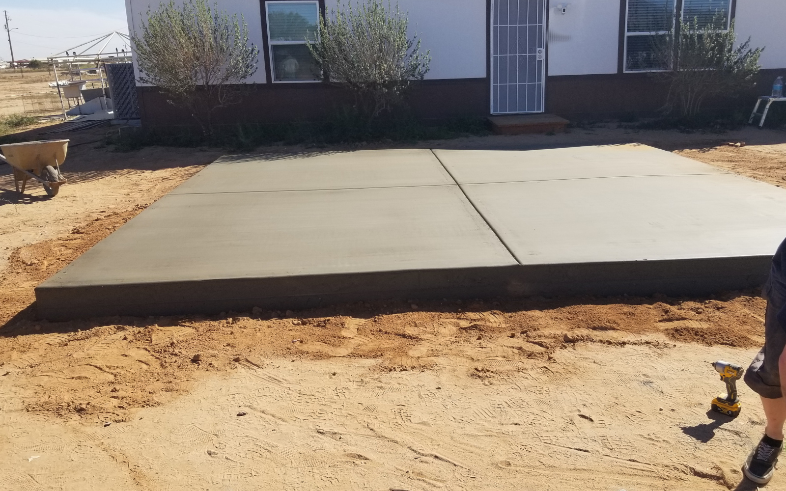 Finished reinforced concrete pad beside a home in Maricopa, Arizona.