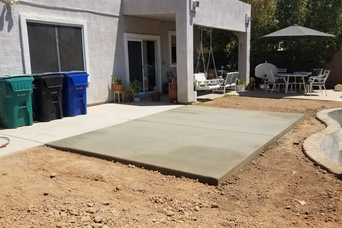 Finished angle view of the new concrete pool patio addition in Mesa, Arizona.