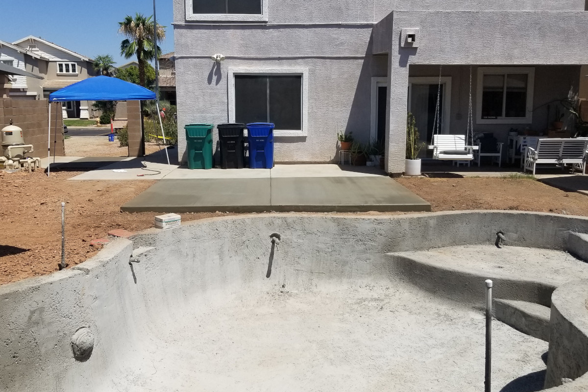 Finished concrete pool patio addition in Mesa, Arizona.