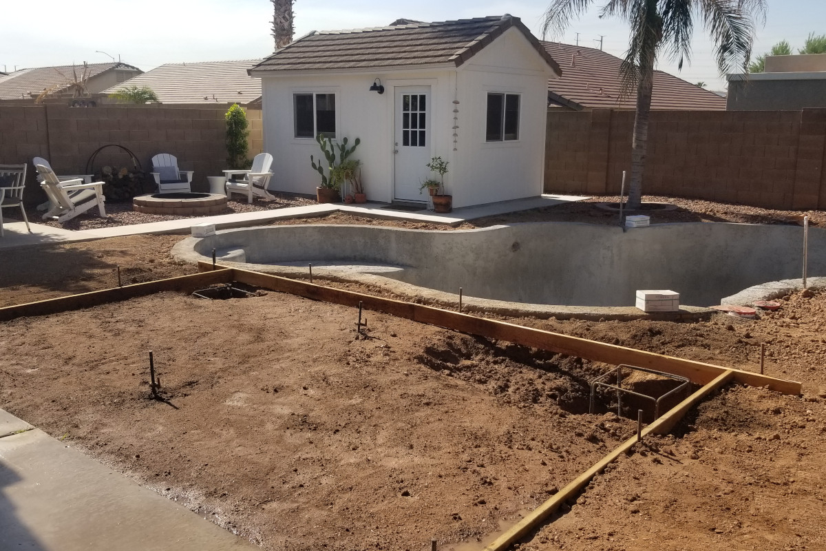 Concrete patio forms and reinforced column footing locations for a Mesa poolside patio addition.