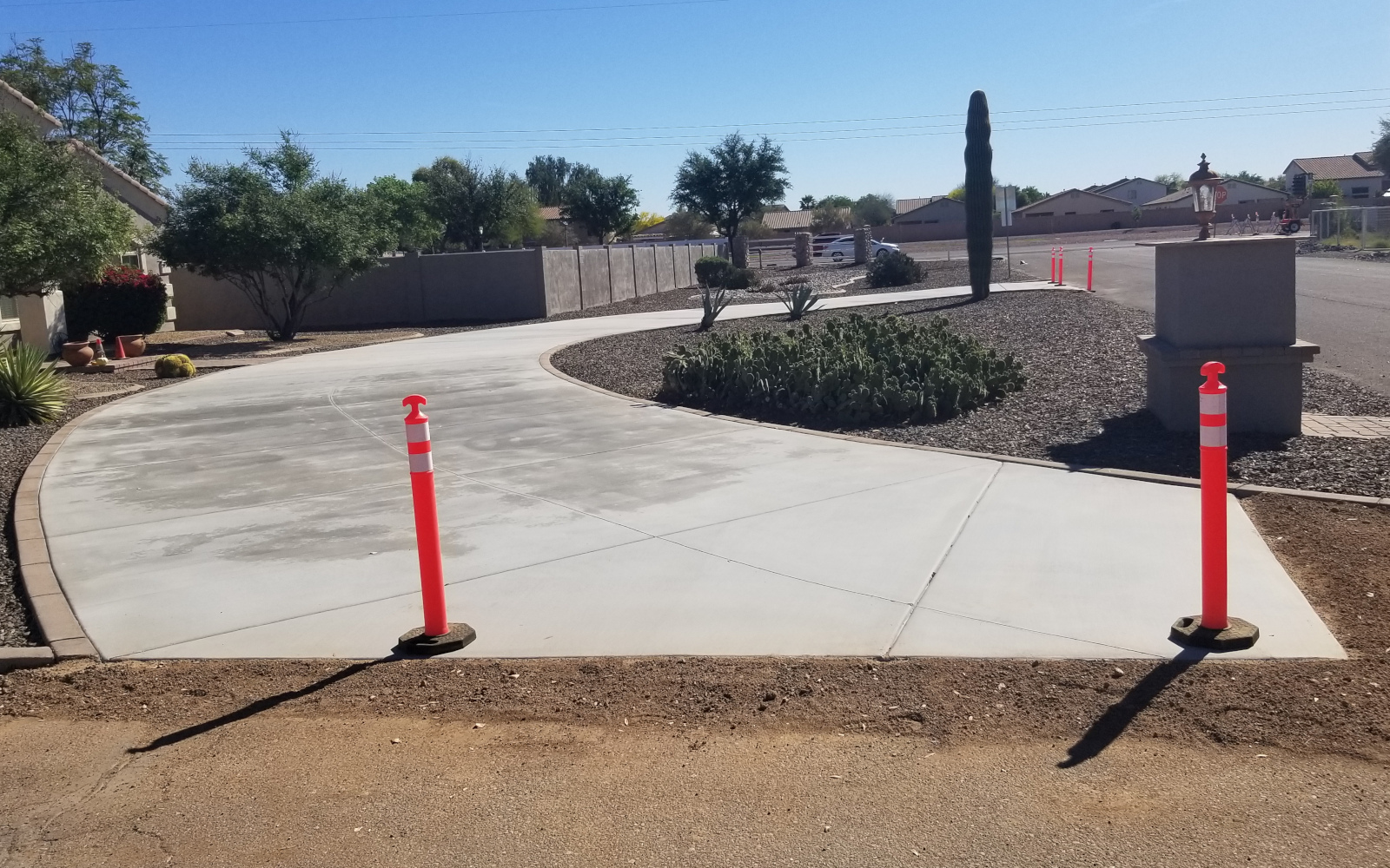Wide view of a completed circular concrete driveway in San Tan Valley