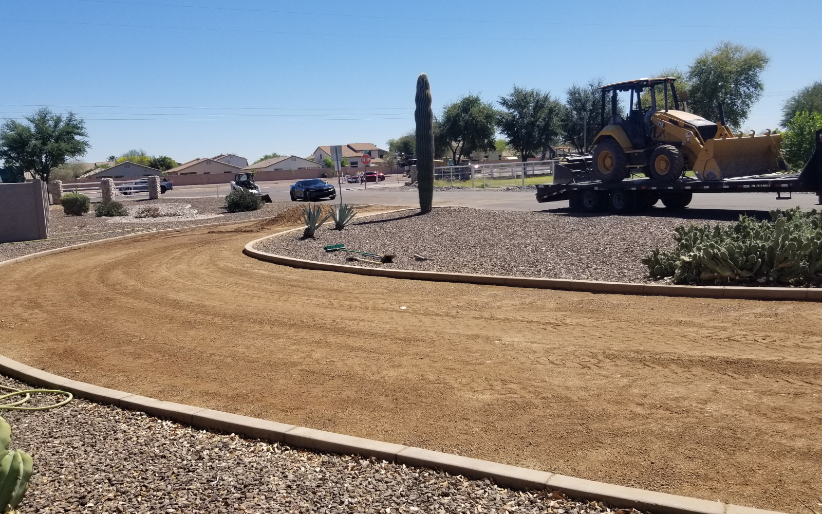 Prepared curved driveway route around a landscaped island in San Tan Valley