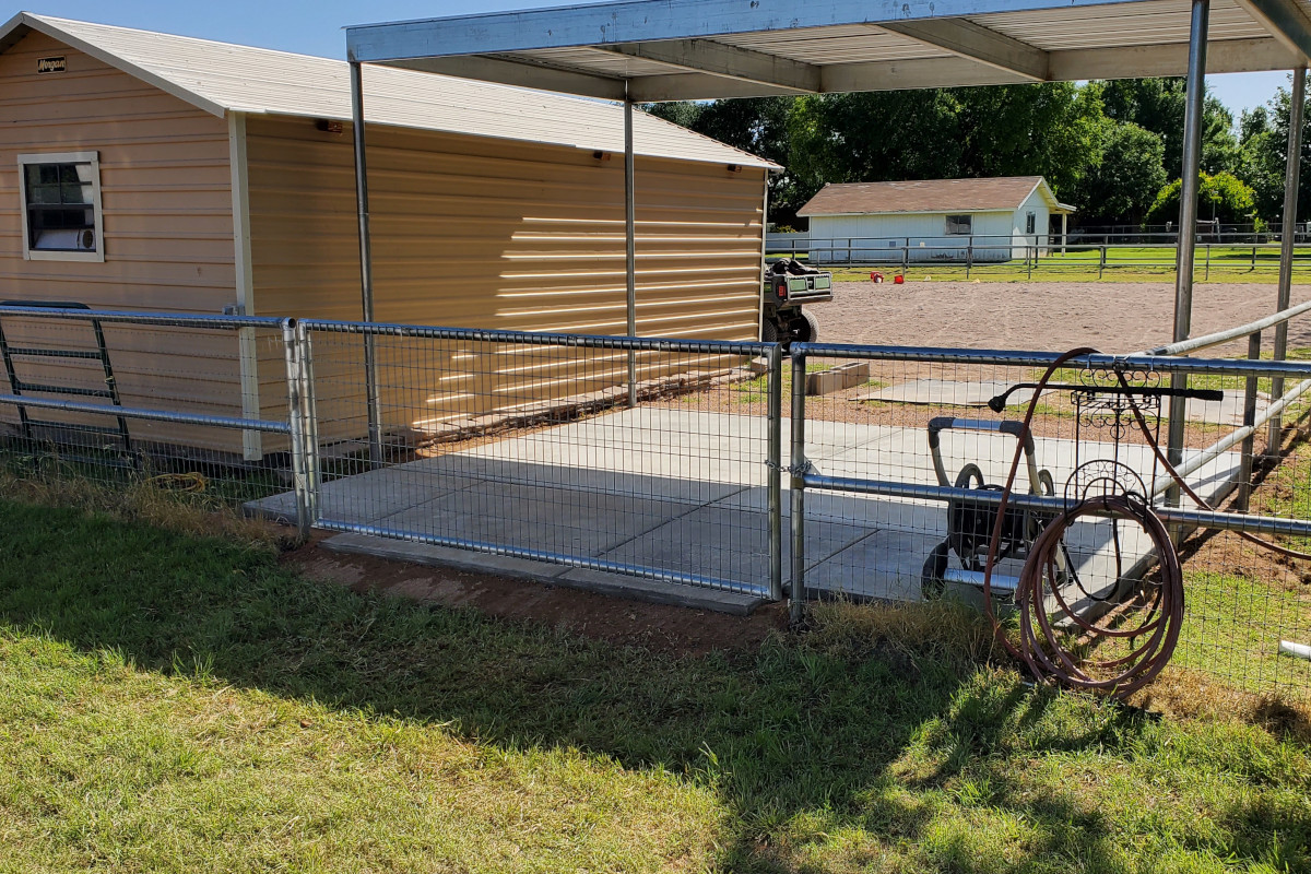 Front view of the finished storage concrete pad and covered equipment area in Queen Creek.