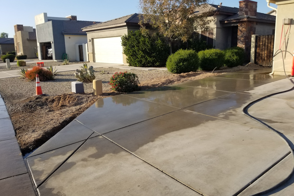 Finished concrete driveway extension beside a Gilbert home